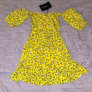 PrettyLittleThings yellow (flowered) off the shoulder dress